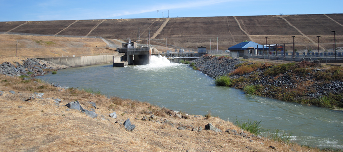 Photo of Howard Hanson dam with water being released.